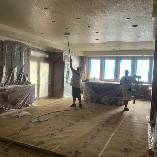 American Mastercraft painters painting the ceiling of a large kitchen