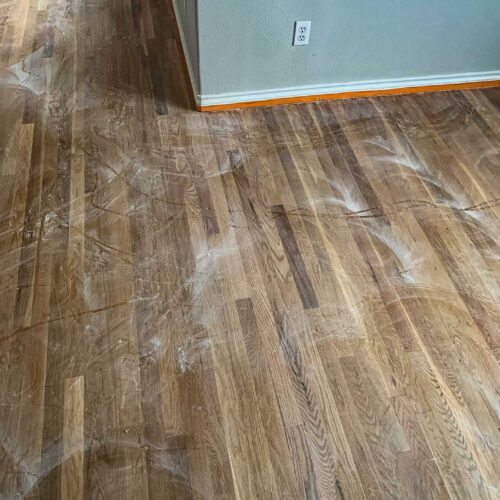 Dusty wooden floors in a living room