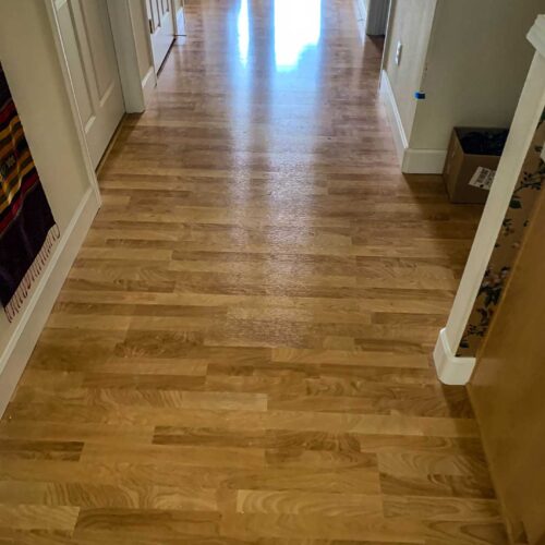 Hallway wooden floors, white walls and doors