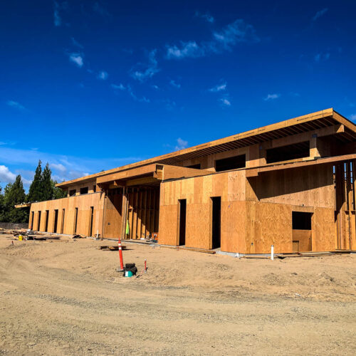 New construction home being built with wooden side walls