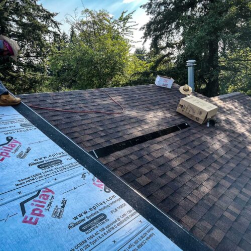 American Mastercraft worker replacing a section of a roof.