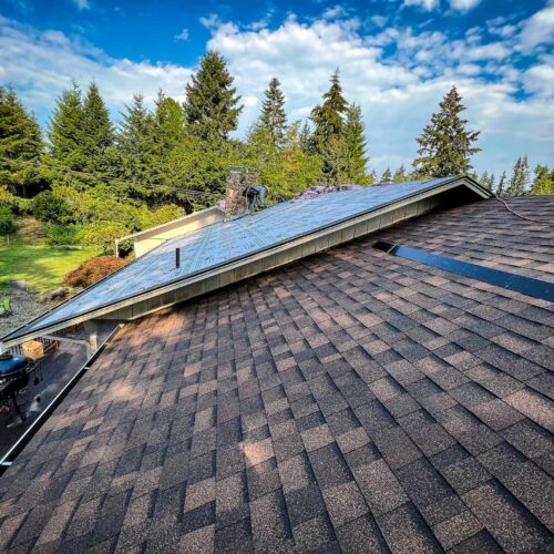 American Mastercraft worker replacing a section of a roof.