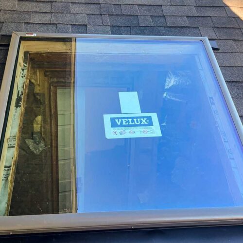 Velux window on a shingled roof