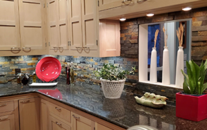 Modern kitchen remodel in Portland OR home features stone countertops, custom wood cabinetry, and gorgeous backsplash